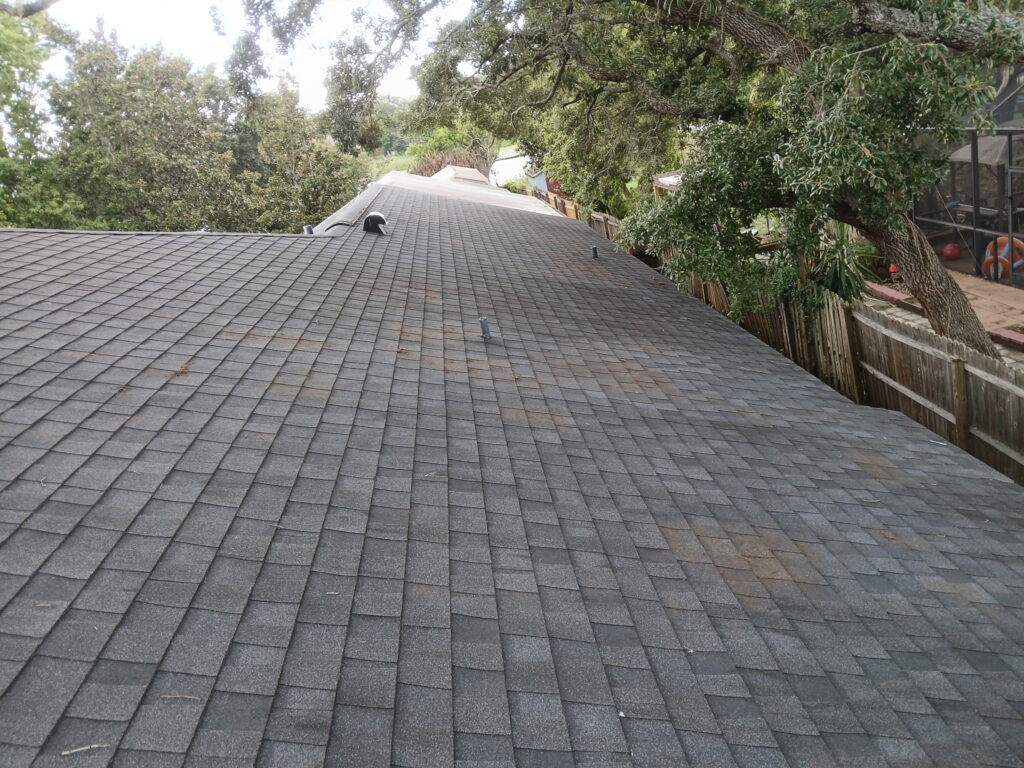 After roof cleaning with debris removed from a shingle roof in Central Florida