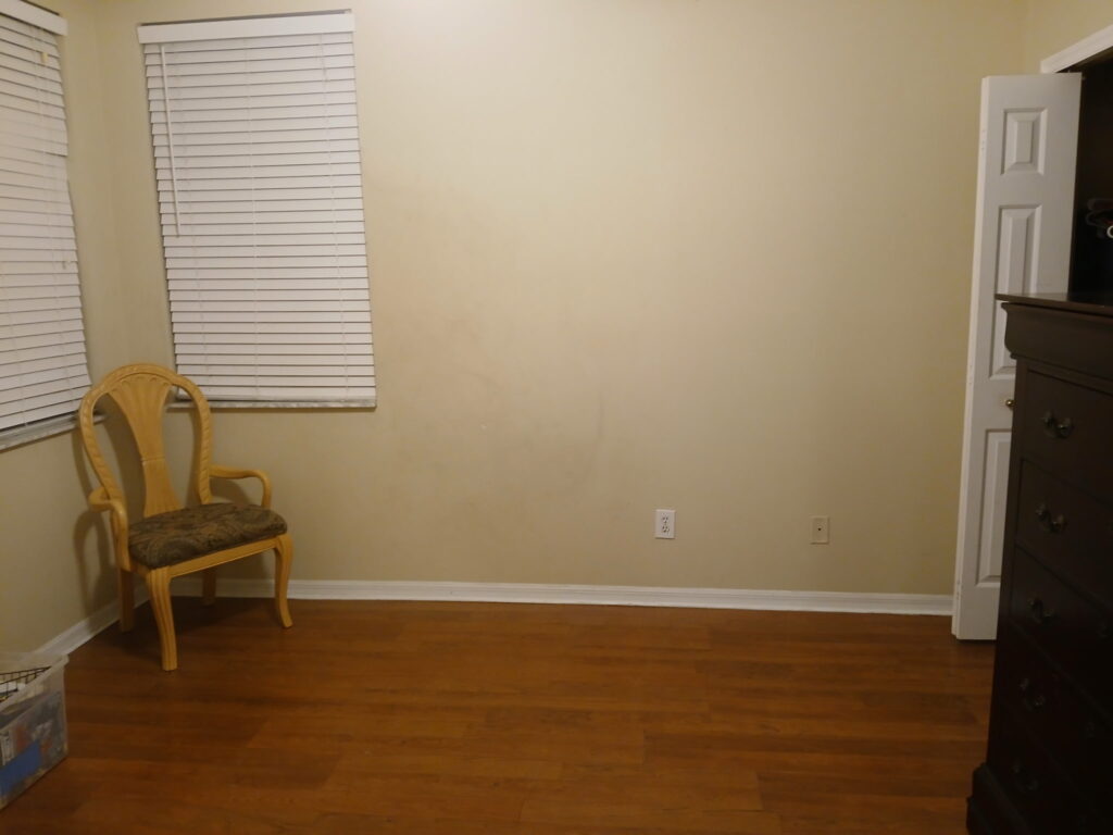 Clean room after house cleaning and organization with open floor space