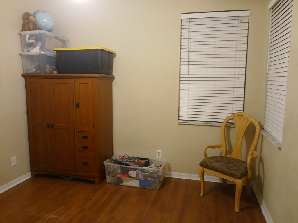 Room organization detail with dresser and chair in a clean bedroom area