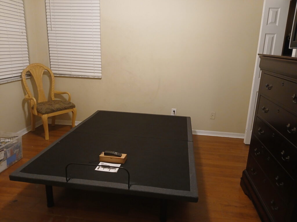 Organized bedroom space with furniture arranged and floor area cleared
